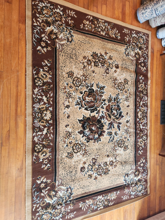 5.3 x 7.5 Brown Area Rug